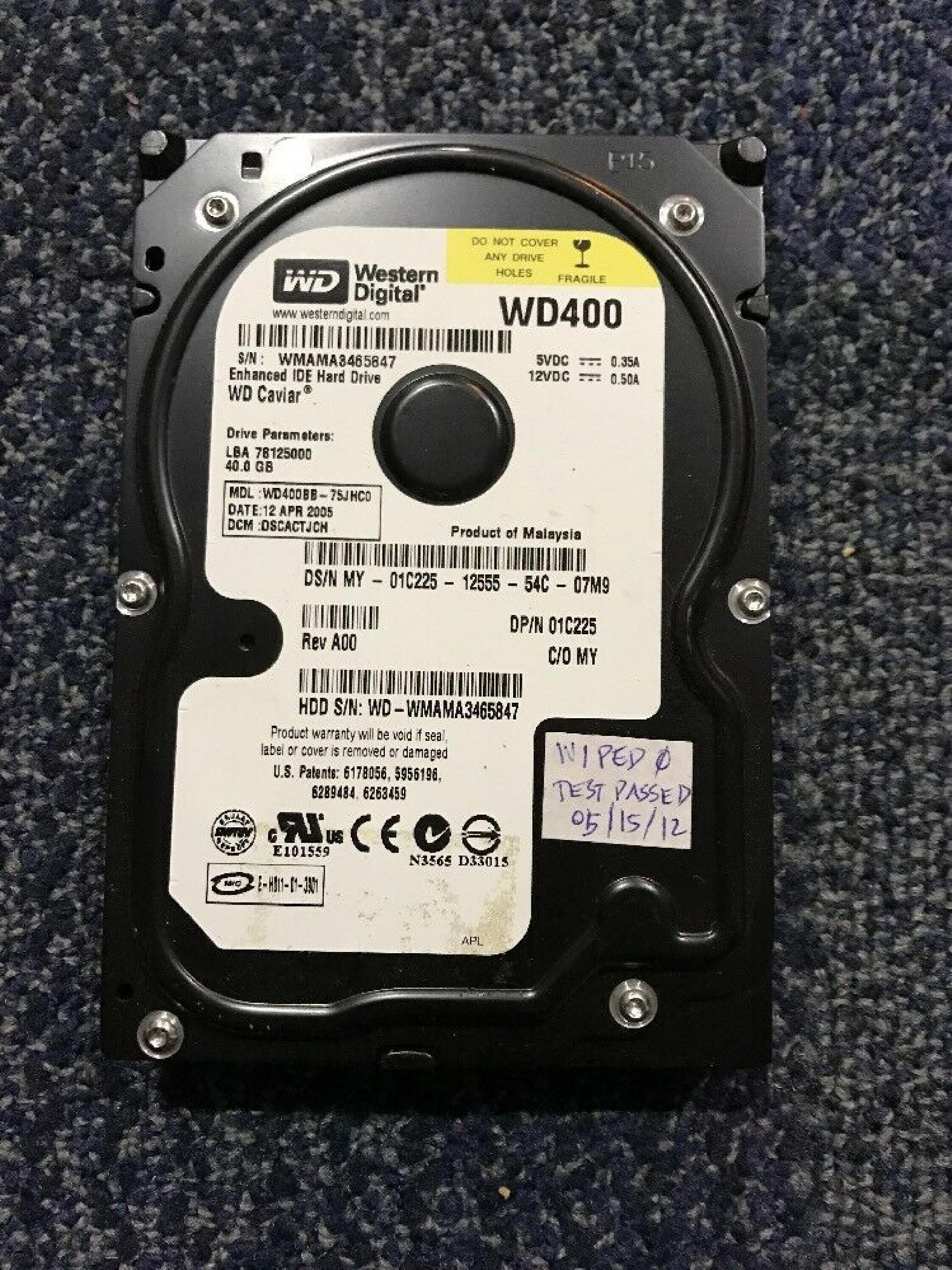 WESTERN DIGITAL / WD WD400BB-75JHC0 40GB IDE HD LBA 78165360 DATE 09 NOV 2005 DCM ESBACTJCA 78125000 22 DEC HSBHNTJCA REV A00 CAVIAR 10 MAR 2006 HSBHCTJCH 25 AUG HSCHNTJAH