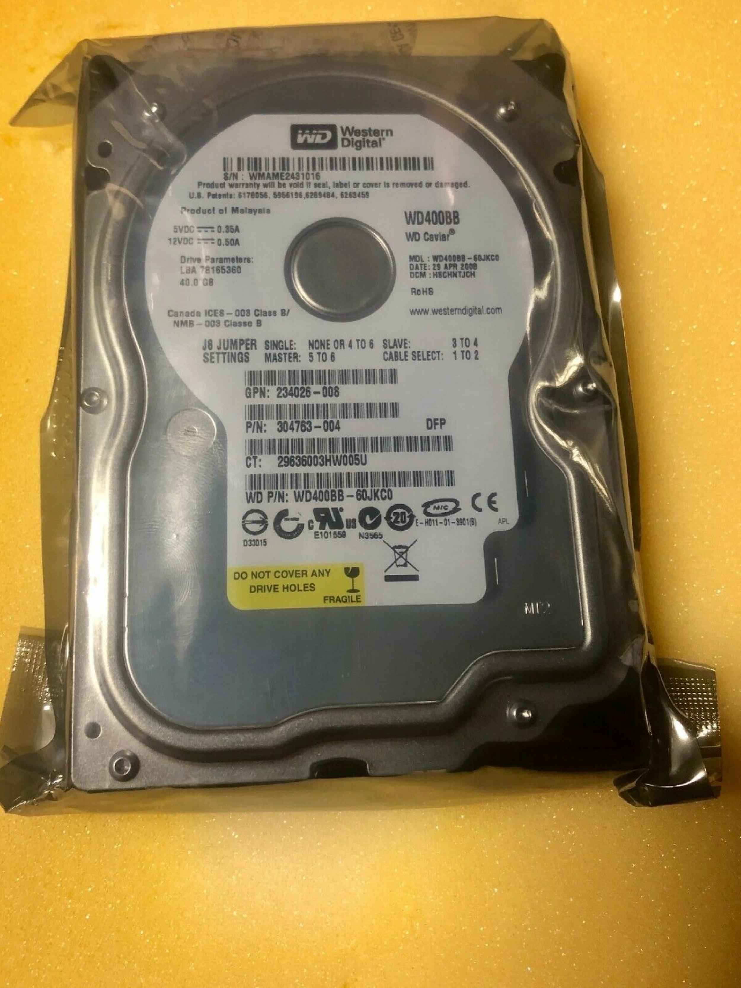 WESTERN DIGITAL / WD 304763-004 40GB IDE HD LBA 78165360 DATE 06 MAY 2006 DCM HSCHCTJAA 07 AUG 2007 DSBHNTJAHN 20 JUN DSBHCTJEH CAVIAR