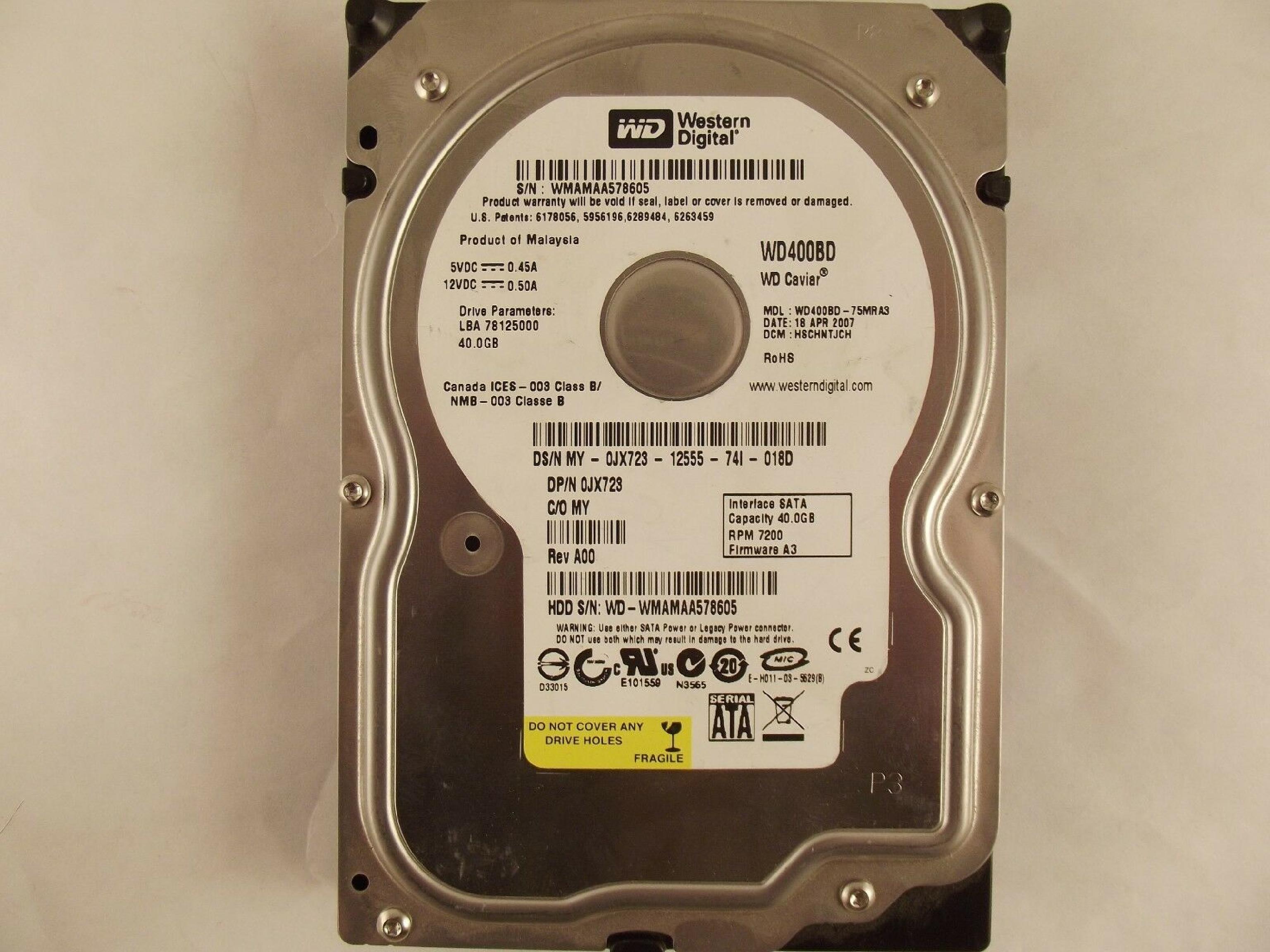 WESTERN DIGITAL / WD 0JX723 40GB SATA HD DATE 24 JUL 2006 DCM HSCACTJCA REV A00 CAVIAR 29 NOV HSBANTJCH 05 SEP 27 MAR 2007 ESBHYTJEH 13 ESBHCTJCH 28 HSBHNTJCH ESBACTJCA ESCACTJCH