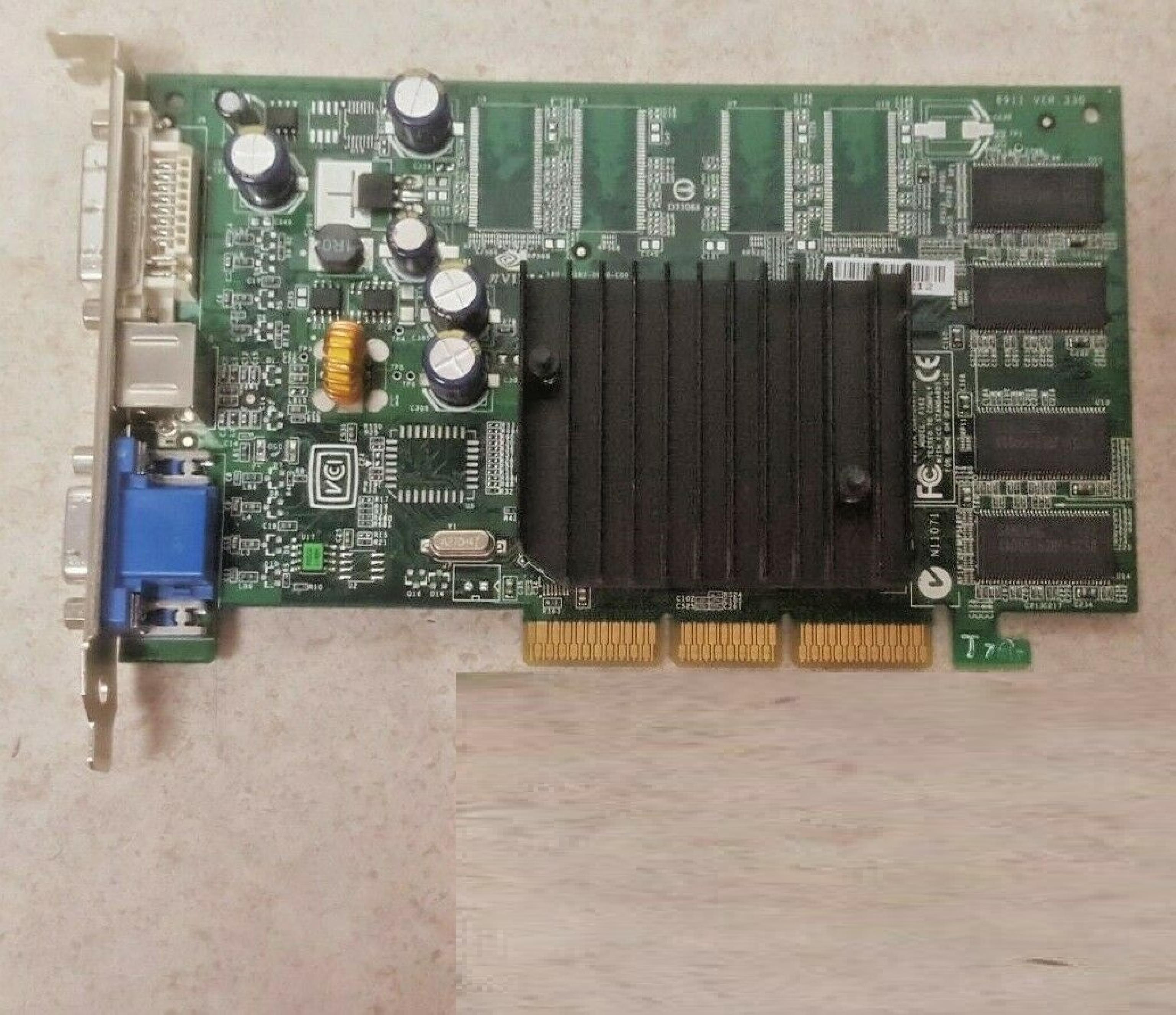 NVIDIA 8911 VER:330 128MB AGP VIDEO CARD WITH DVI VGA AND SVIDEO OUTPUTS 64MB