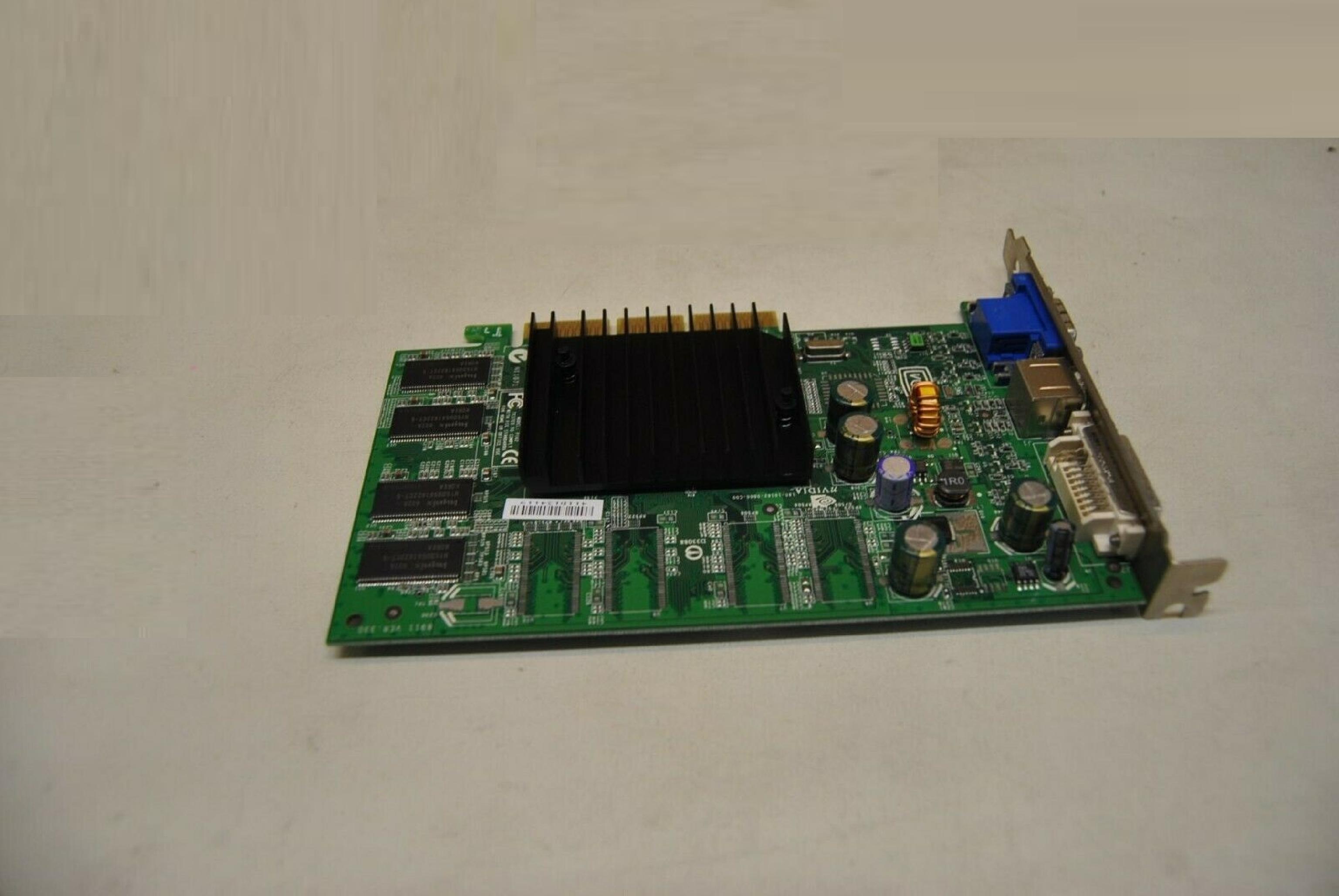 NVIDIA 8911 VER:330 128MB AGP VIDEO CARD WITH DVI VGA AND SVIDEO OUTPUTS 64MB